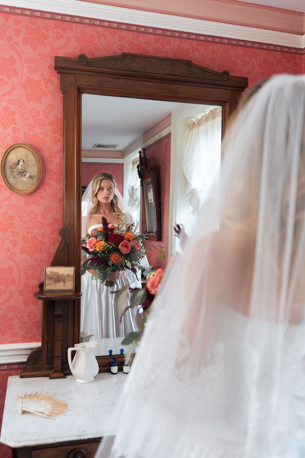 Bride getting ready in the pink room at the Parry Mansion
