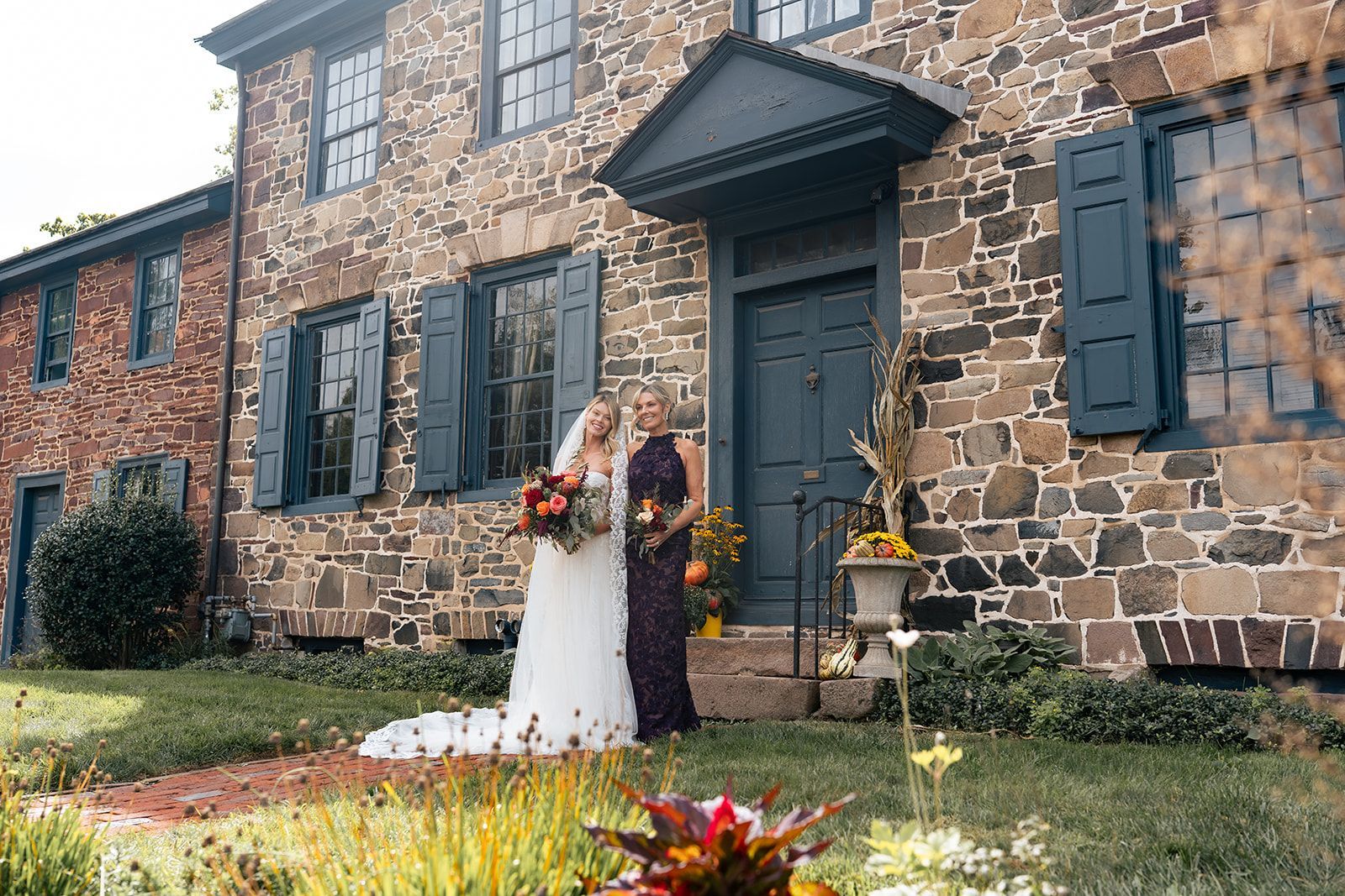 Image of a bride and her mother outside the Parry Mansion