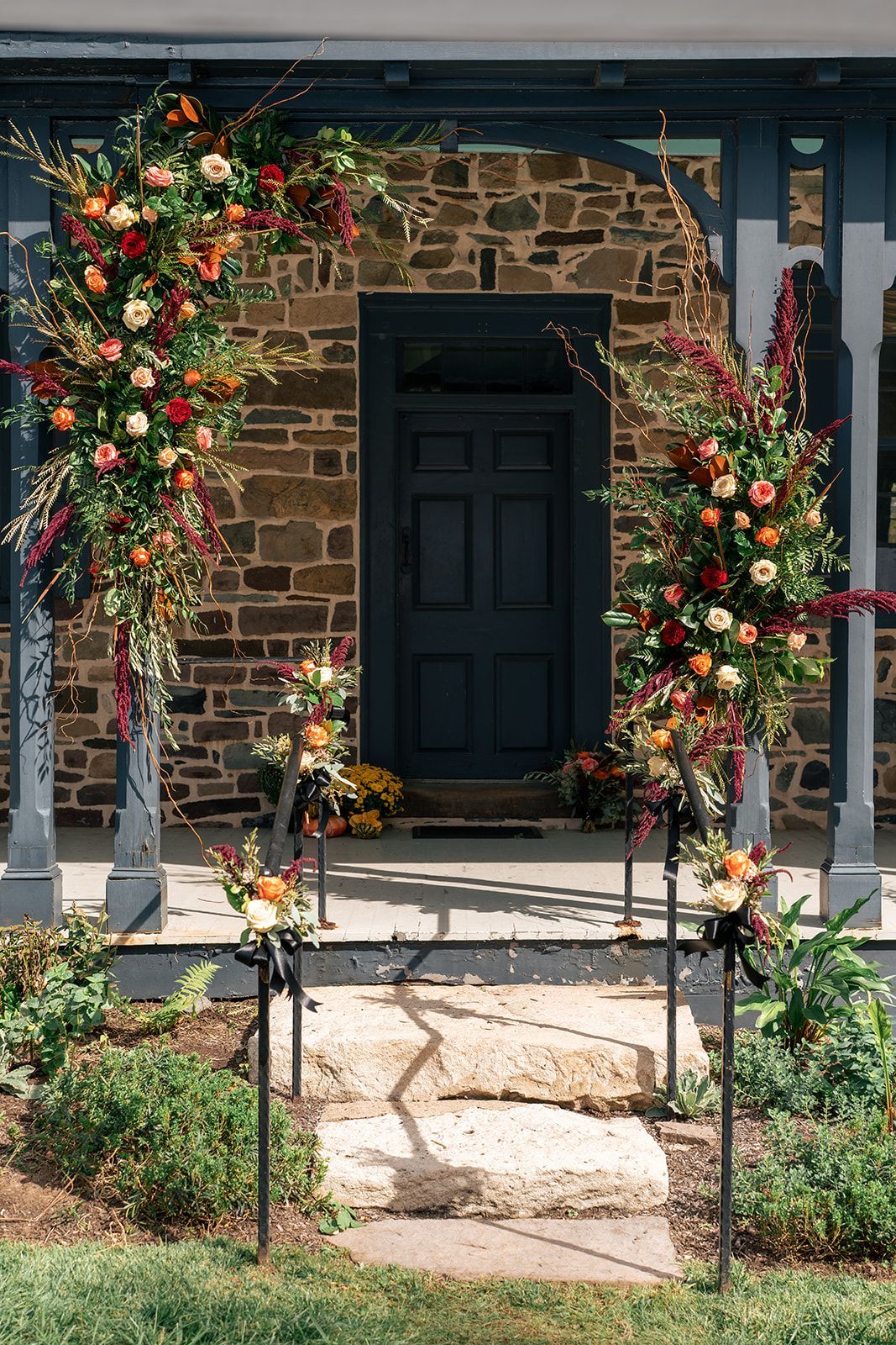 Image of the doors to the mansion, decorated with florals