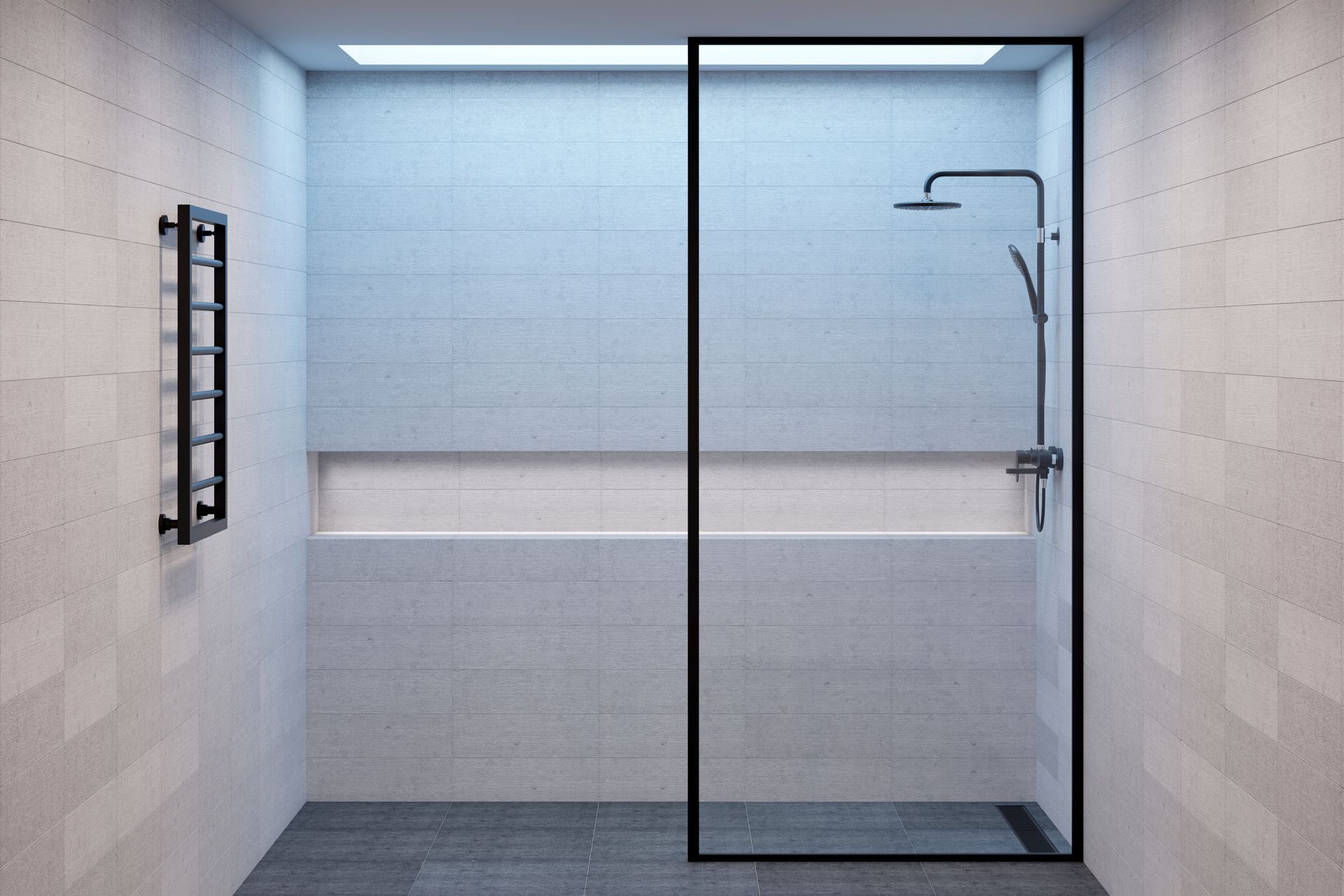 Modern tiled bathroom with a glass-enclosed shower and wall-mounted showerhead Modern tiled bathroom with a glass-enclosed shower and wall-mounted showerhead