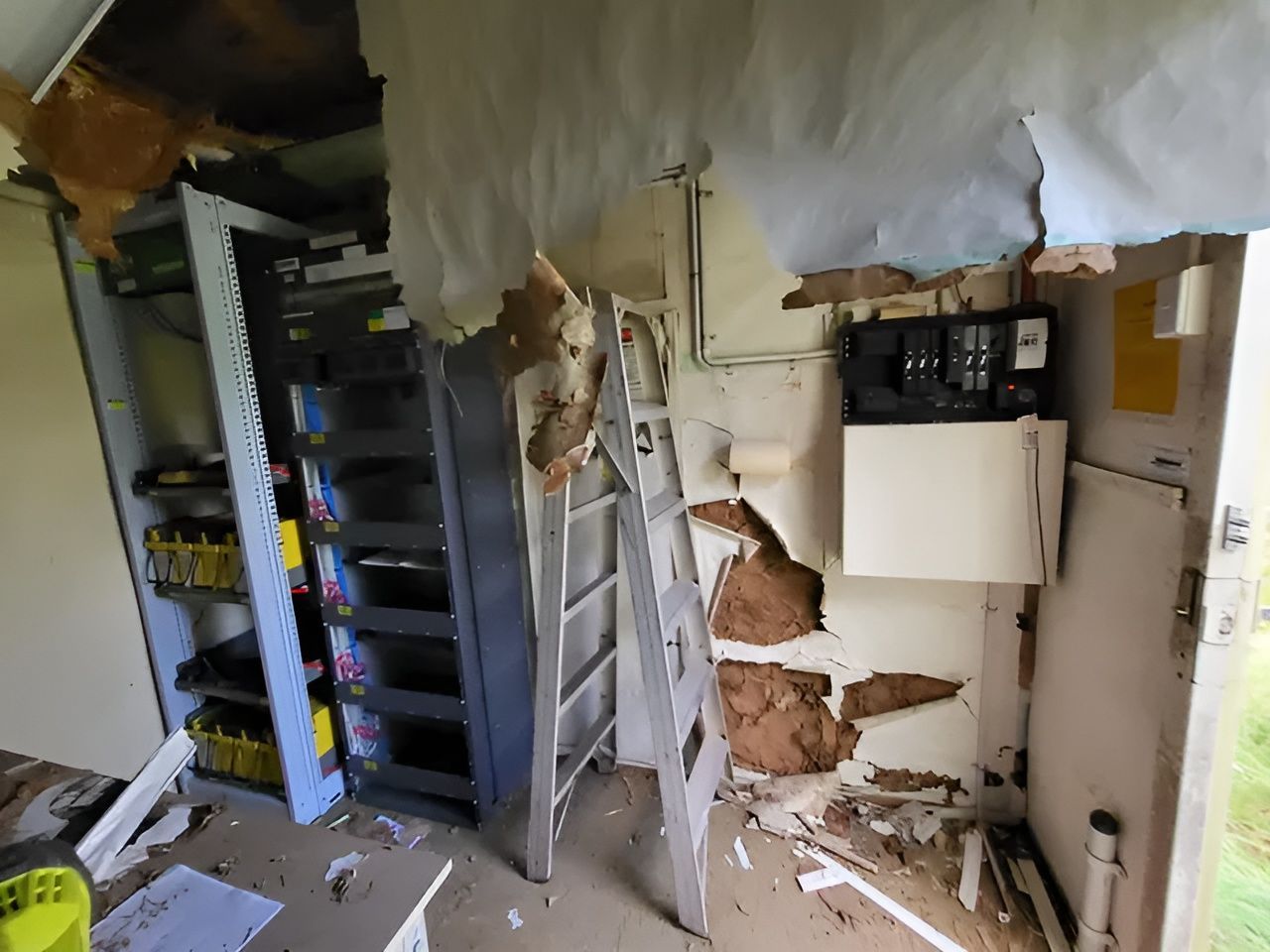 A Room With a Ladder in It and a Broken Ceiling — Superior Termite & Pest Control in Bundaberg, QLD