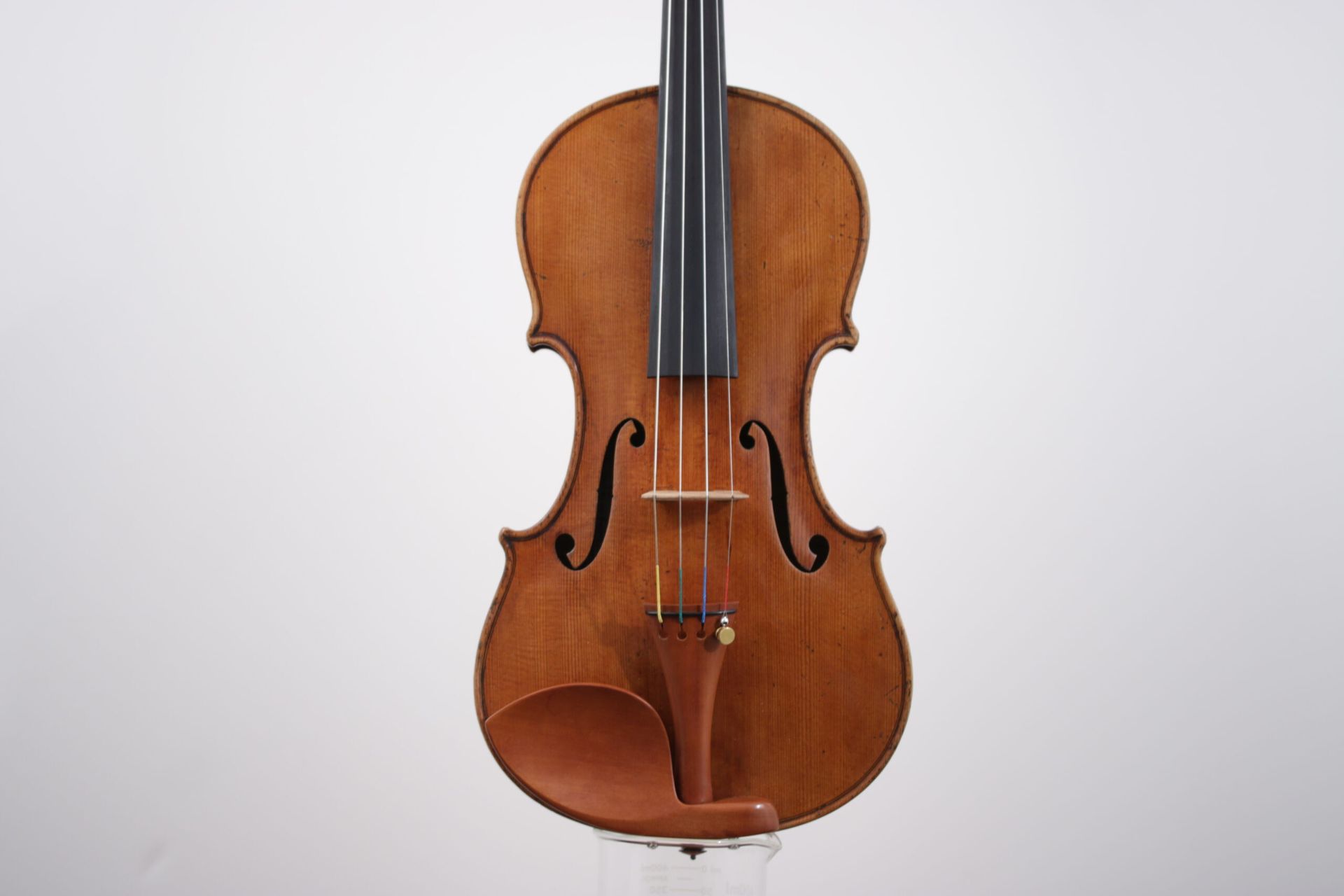 A person is playing a violin with a bow