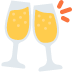 Two wine glasses filled with yellow liquid on a white background.