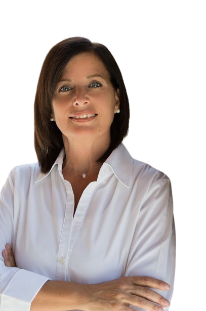 A woman in a white shirt is smiling with her arms crossed