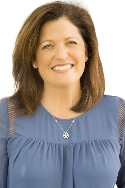 A woman wearing a blue shirt and a necklace is smiling.
