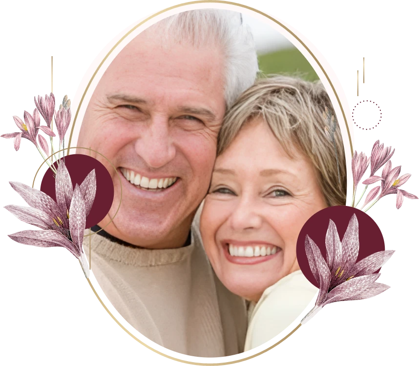 Smiling couple framed by a gold oval with floral accents