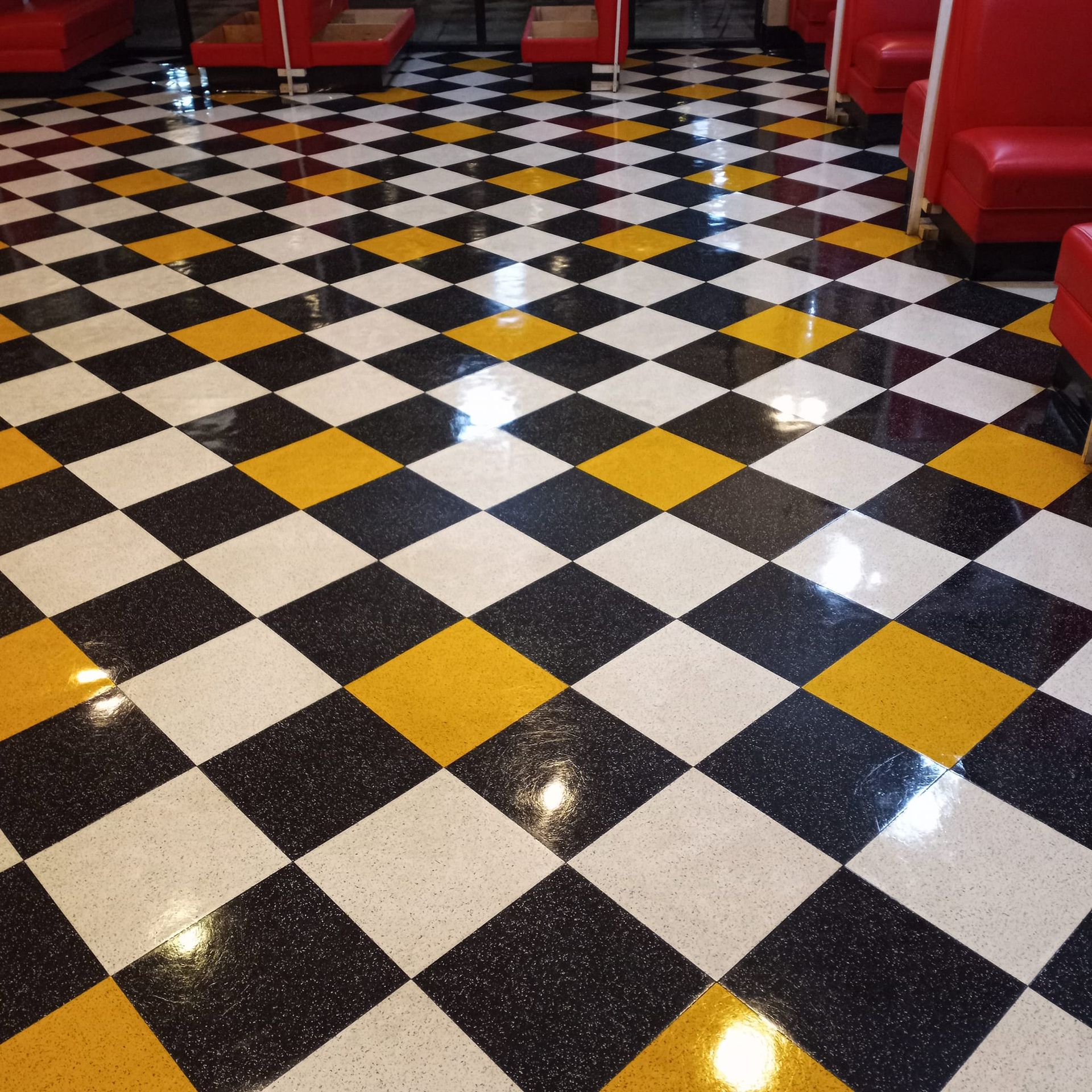 A black and yellow checkered floor in a diner