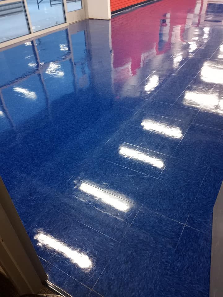 A blue tiled floor with a lot of lights on it.