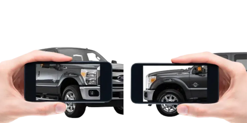 Two smartphones showing a black pickup truck from side and front views on a white background Two smartphones showing a black pickup truck from side and front views on a white background