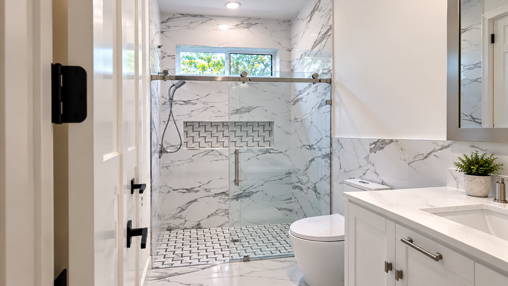 Bright modern bathroom with walk-in glass shower and white vanity