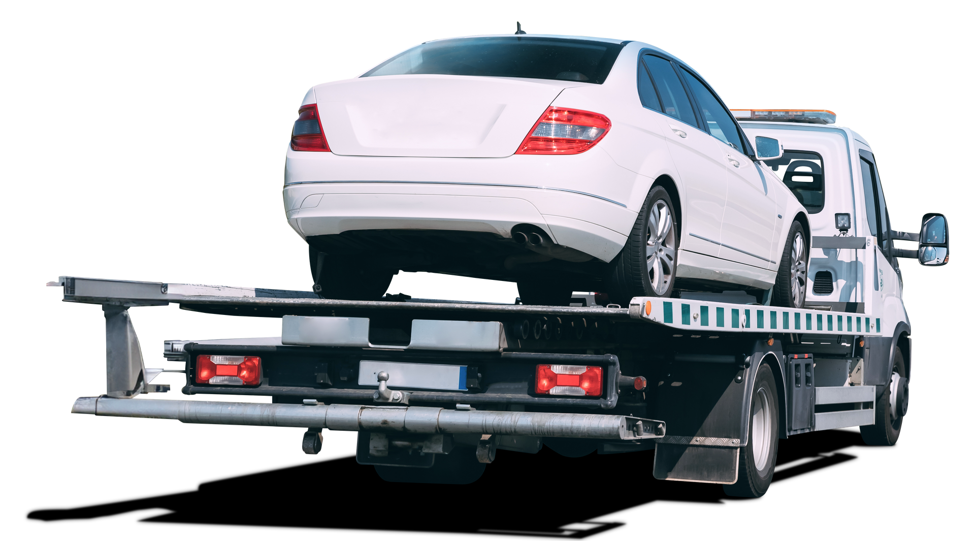 A white car is being towed by a tow truck.