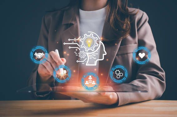 Businesswoman using a tablet with AI concept graphics of a person with a brain and connected icons.