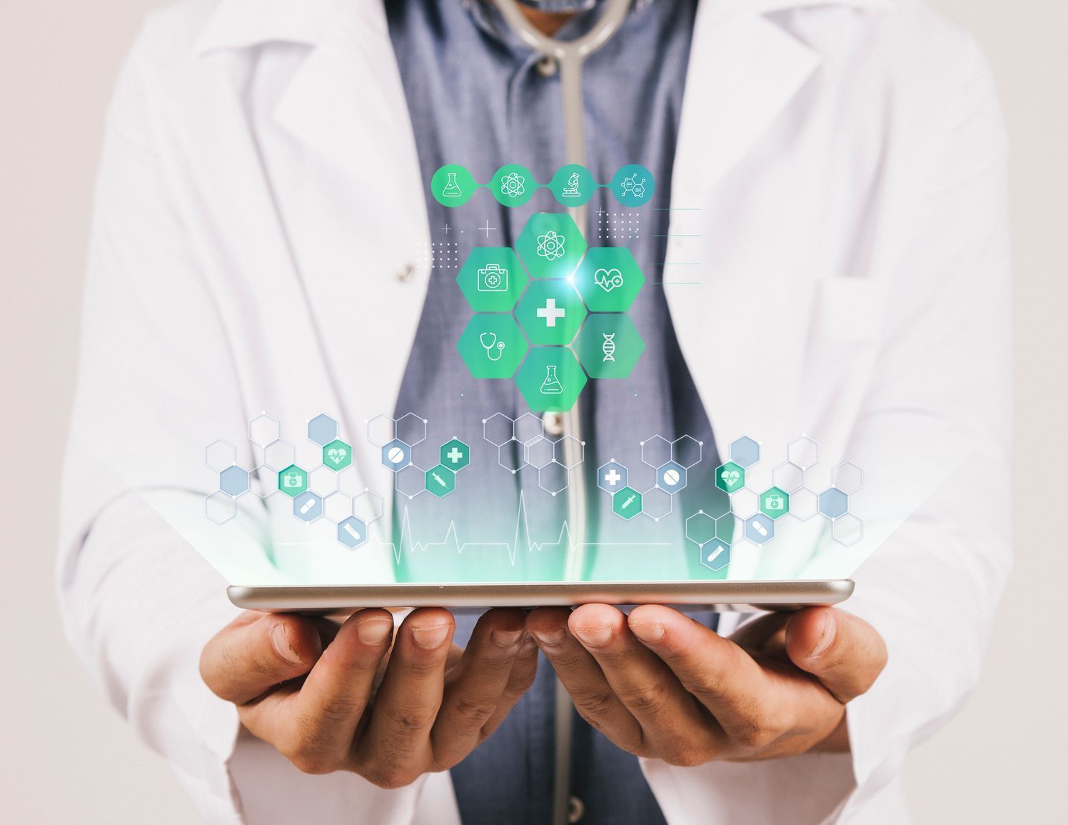 Doctor holding tablet with glowing medical icons.