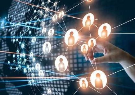 Hand touching a network of connected people icons, overlaid on a world map with glowing lines.