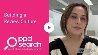 Woman in a black and white sweater discusses building a review culture for PPD Search. Pink background.