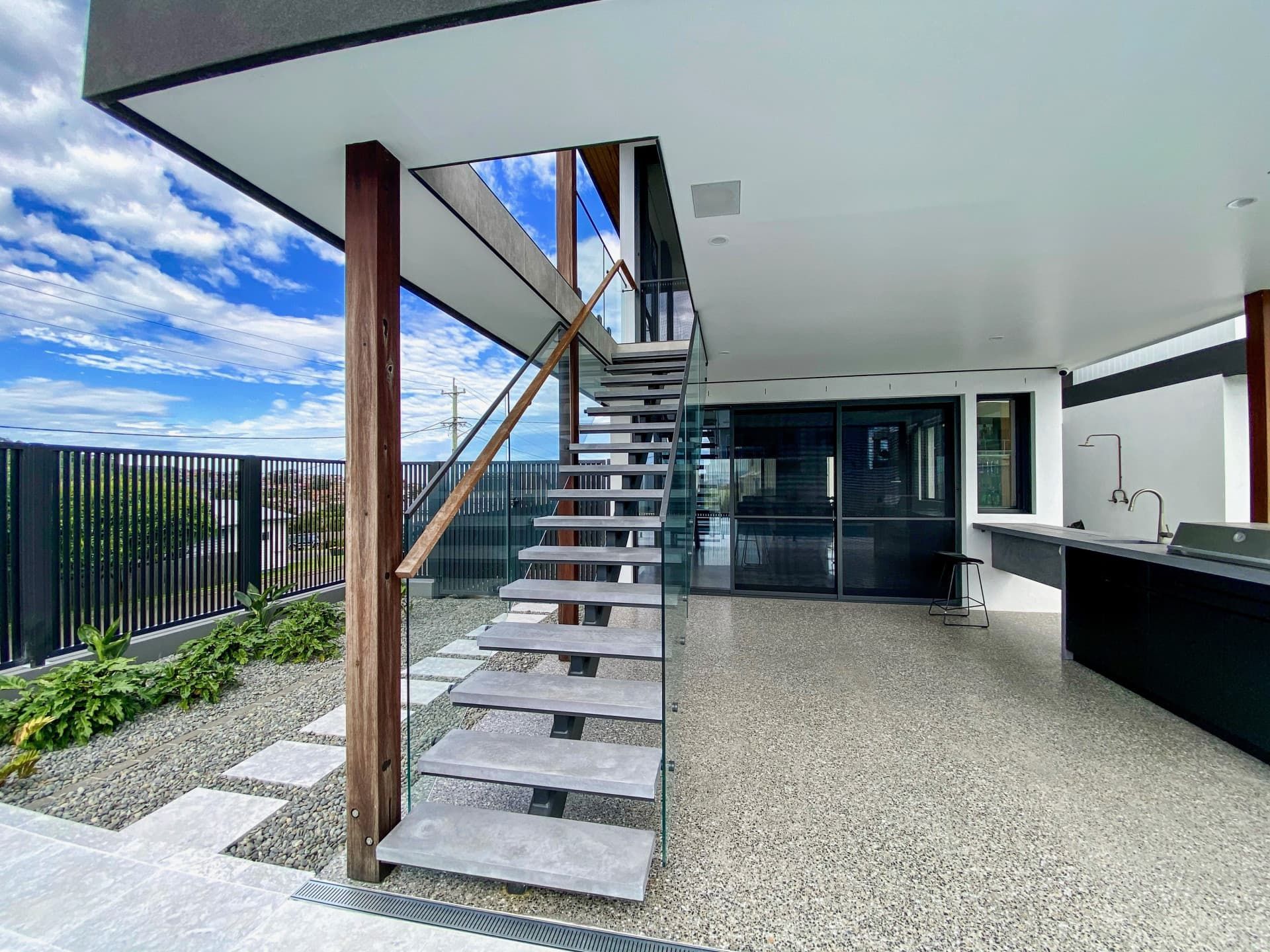 Exterior View of Modern House With Glass — Envisage Construction and Design in Anzac Way, NSW