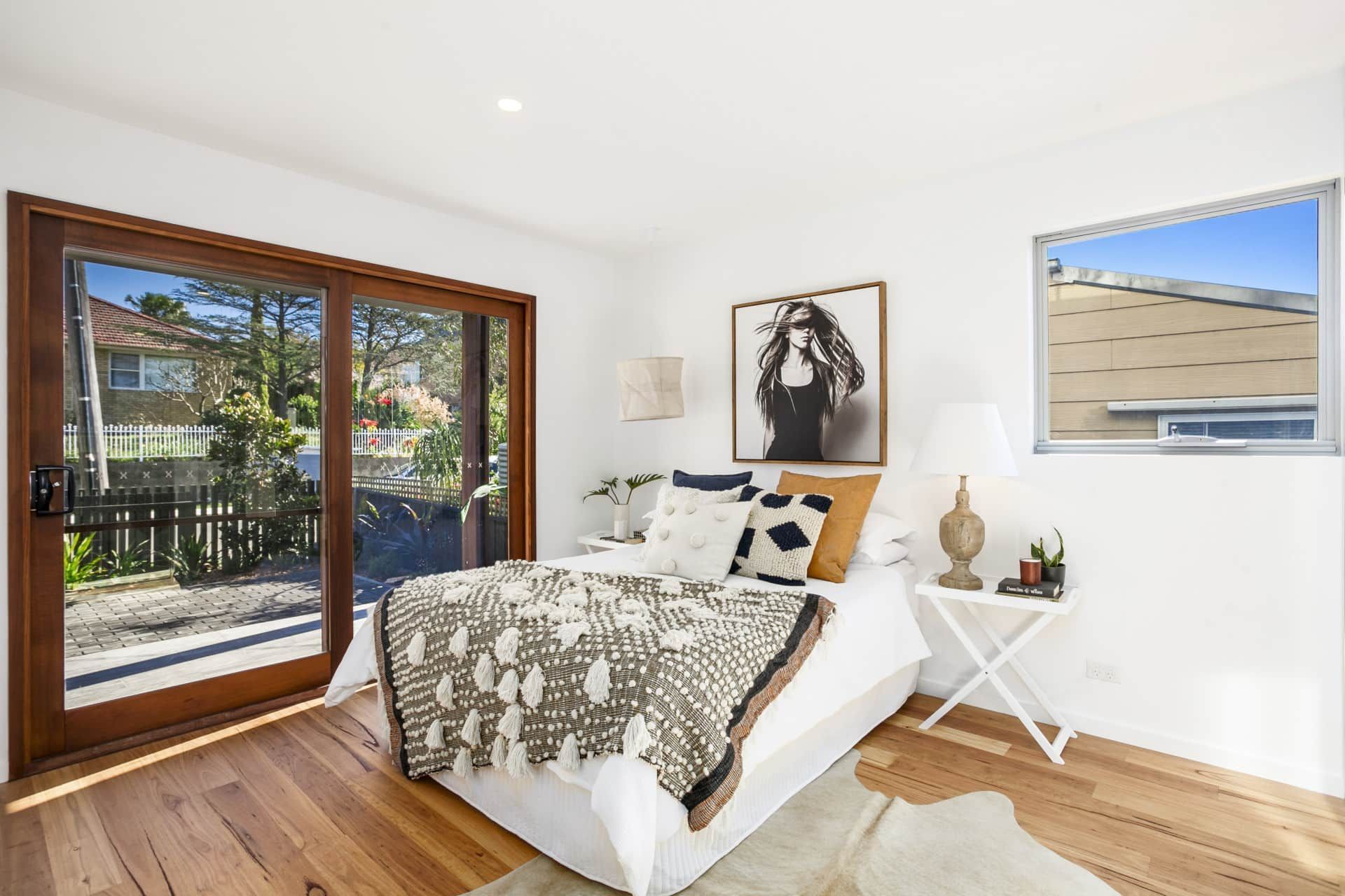 Bedroom With a Bed, Throw Blanket — Envisage Construction and Design in Sydney, NSW