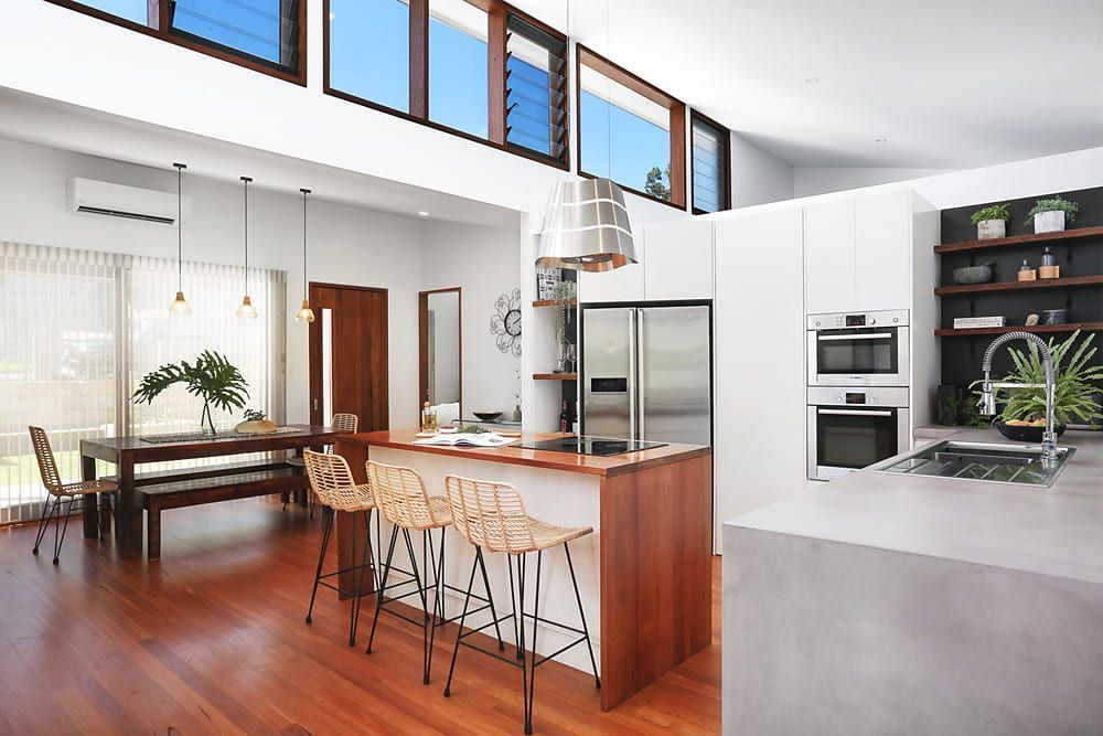 Modern Kitchen With Wood and White Elements — Envisage Construction and Design in Koloona Dr, NSW

