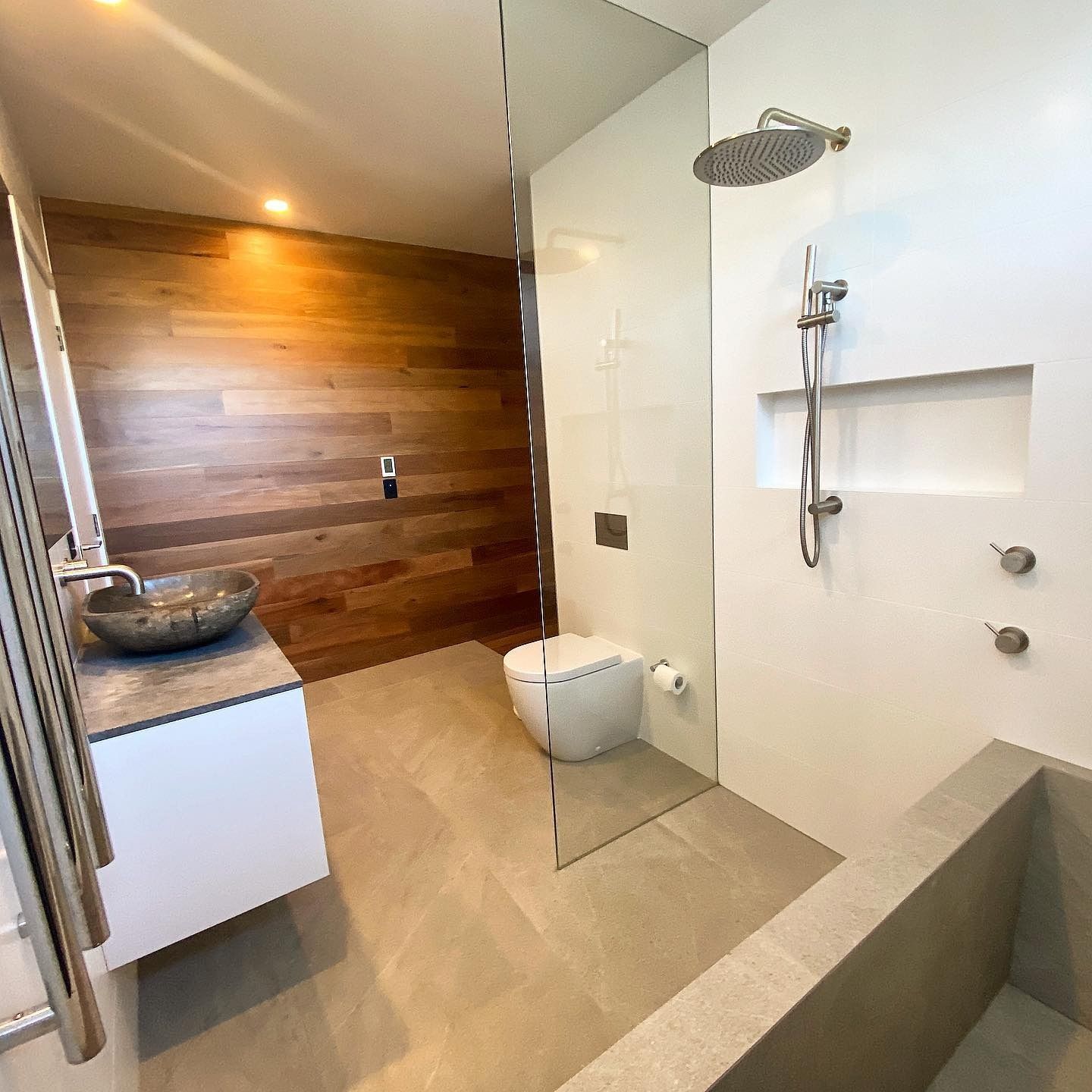 Modern Bathroom With Wooden Wall — Envisage Construction and Design in Mountain, NSW