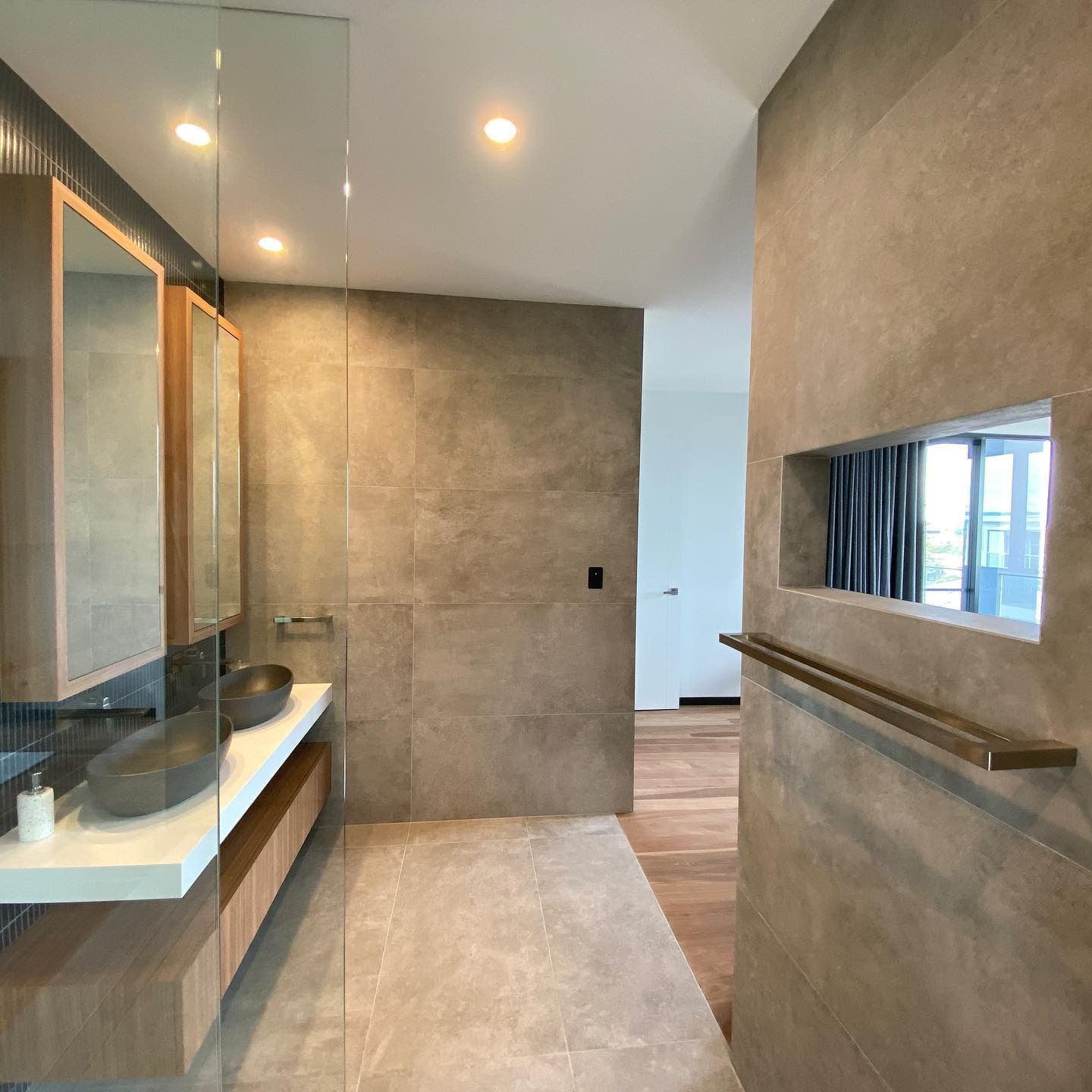 Modern Bathroom With Grey Tile Walls, Wood Accents — Envisage Construction and Design in Batemans Bay, NSW