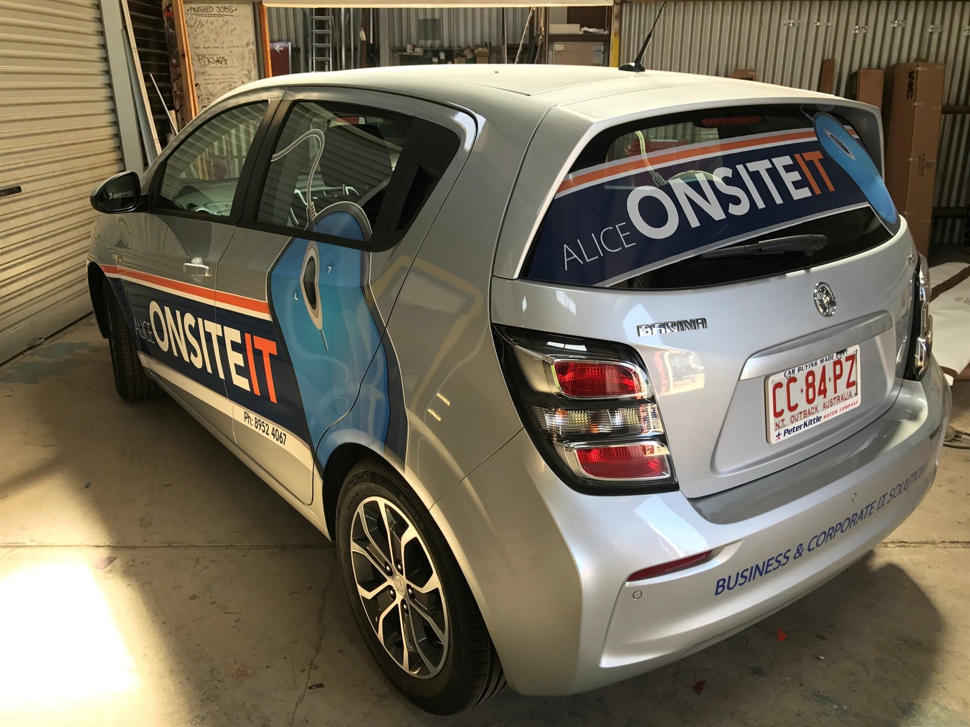 A Silver Car With a Sticker on the Back That Says Alice Onsite — Bluey's Signs in Ciccone, NT