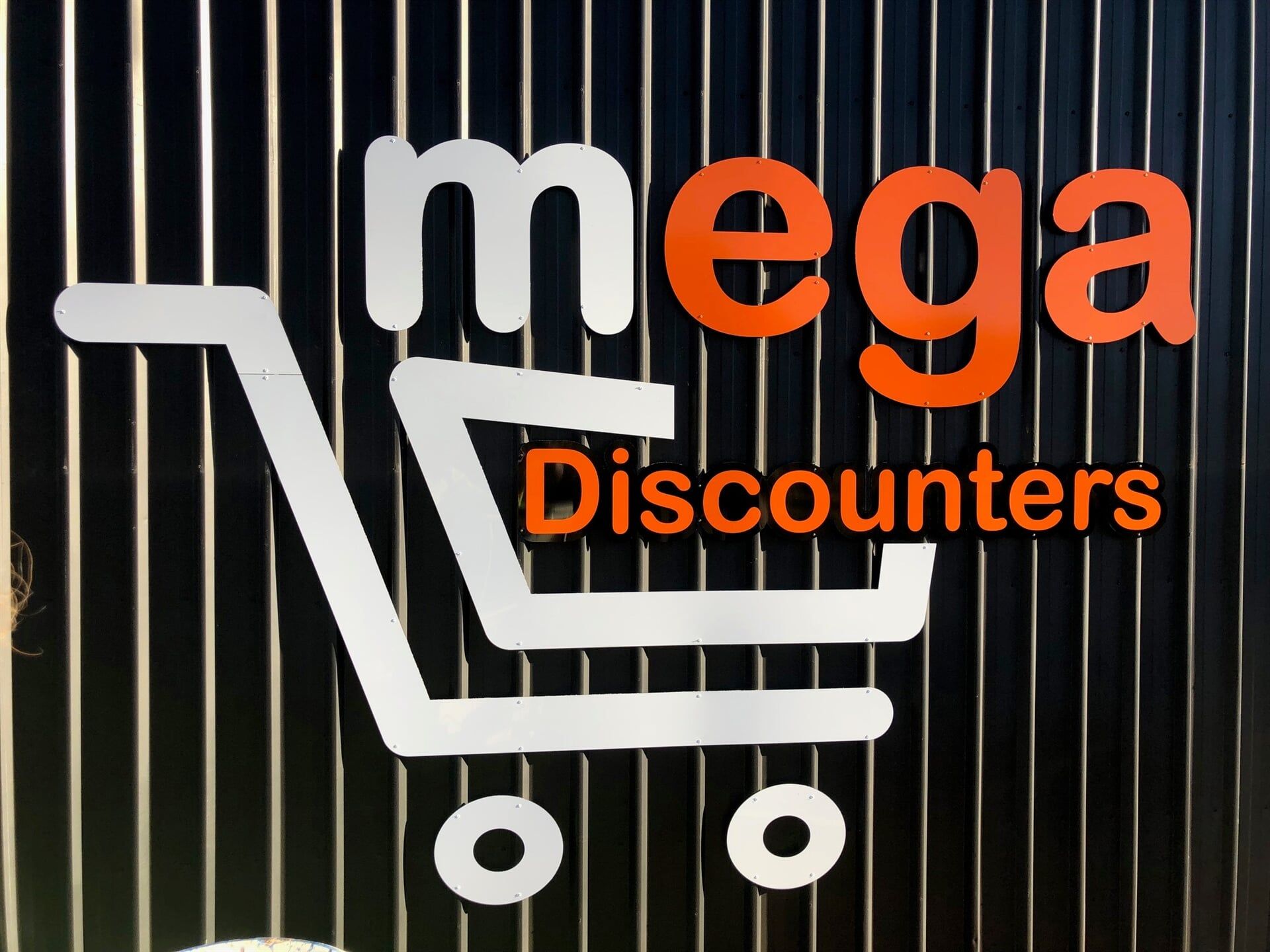 A Sign for Mega Discounters With a Shopping Cart — Bluey's Signs in Ciccone, NT