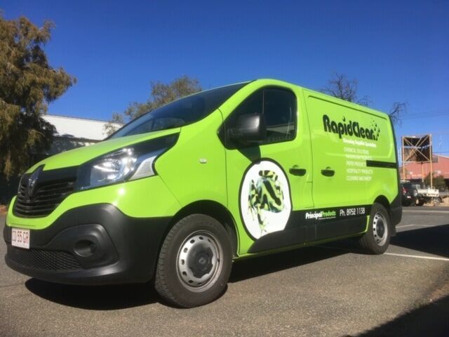 A Green Rapidone Van is Parked on the Side of the Road — Bluey's Signs in Ciccone, NT