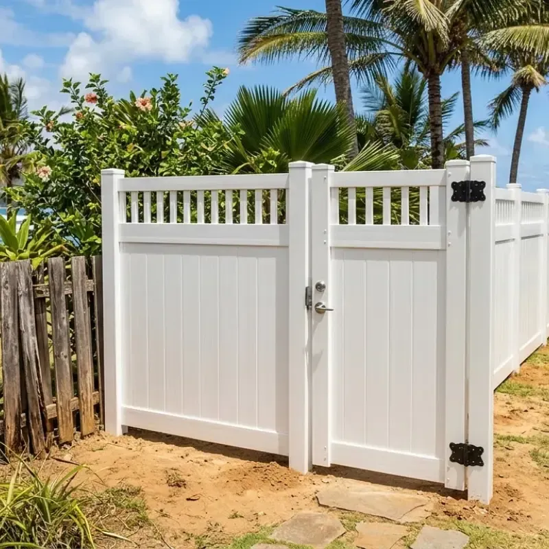 Durable vinyl gate installed in Oahu home, built to withstand Hawaii's coastal humidity, salt air, and sun exposure, outperforming wood and metal fences in low-maintenance and long-term strength.