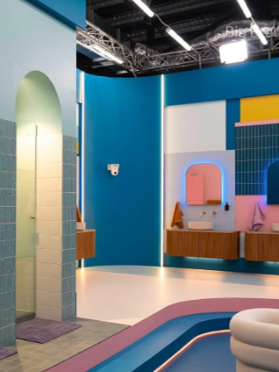 Bright modern interior with blue walls, arched alcove, wood cabinets, and a curved pool edge