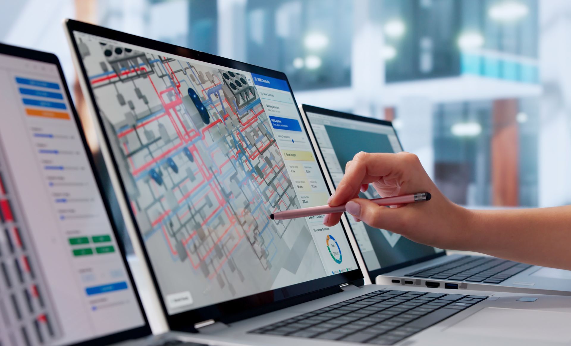 Hand pointing at a financial trading dashboard on a laptop in an office setting Hand pointing at a financial trading dashboard on a laptop in an office setting