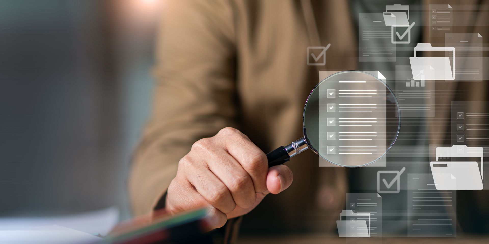 Hand holding a pen over a digital checklist with folder icons, suggesting document management or workflow automation