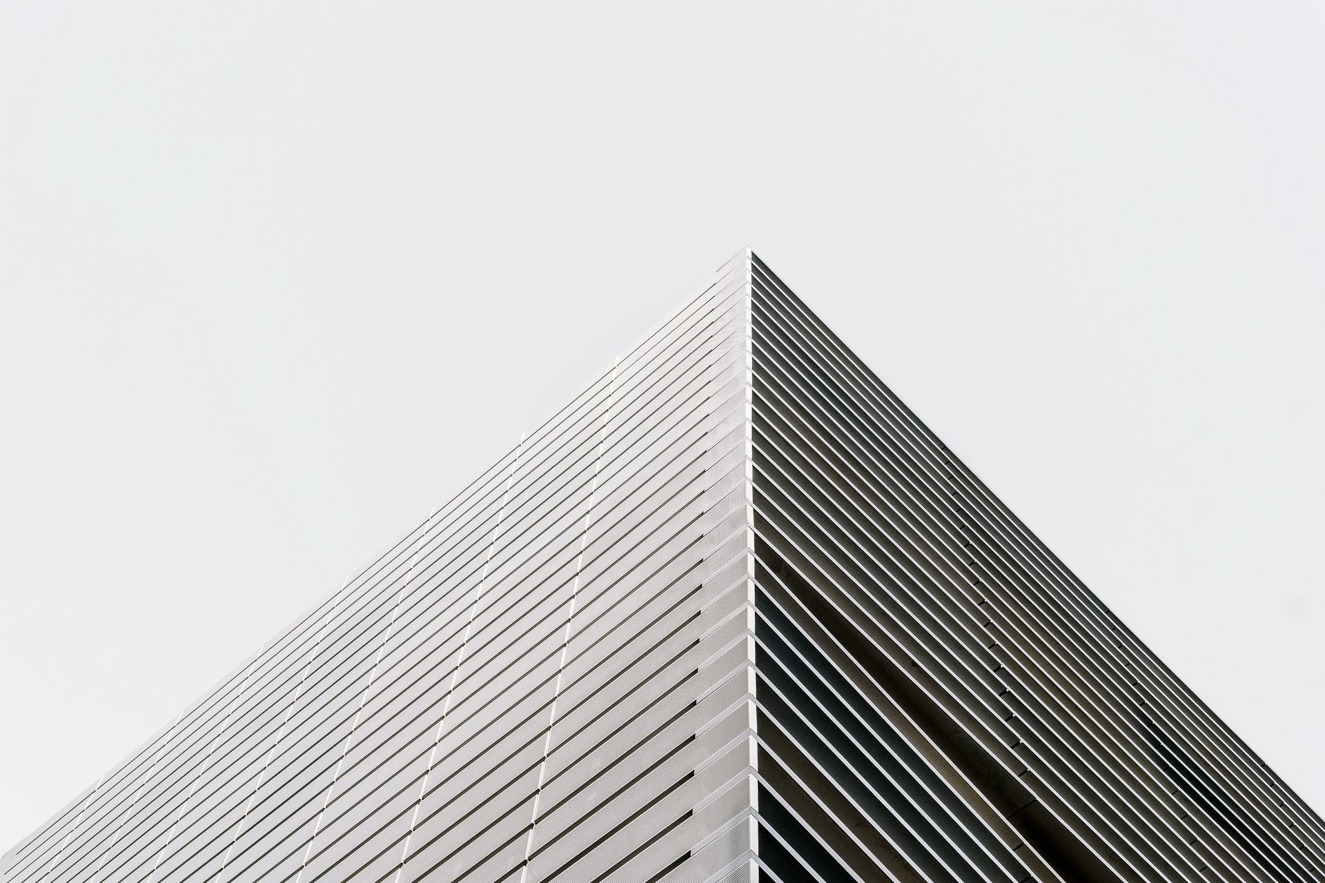 Modern skyscraper corner against a pale sky Modern skyscraper corner against a pale sky