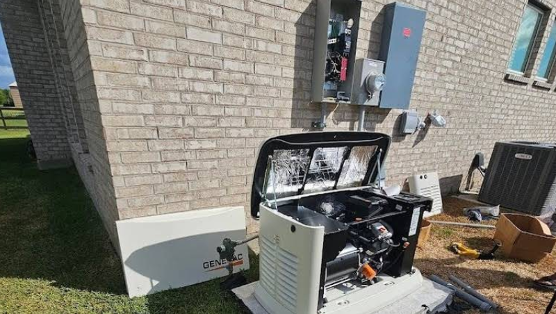 Outdoor HVAC unit with open, damaged top beside a brick house and electrical panel
