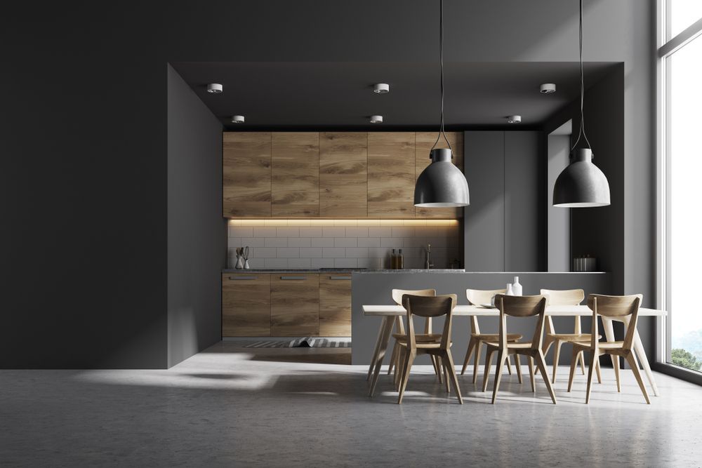 A Kitchen With a Dining Table and Chairs in It — Peter Betros Homes in Highfields, QLD