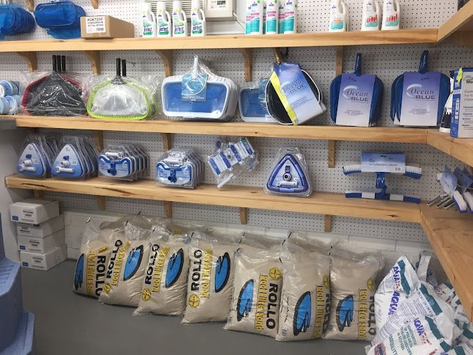 A bunch of bags of otto rollo are lined up on a shelf
