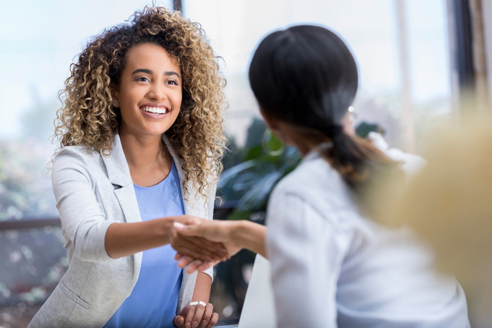 Doctor and billing analysts shake hands | Irvine, CA | Altos Inc