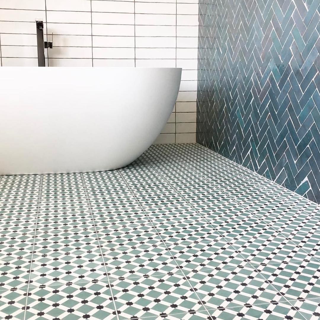 A Bathroom With a Bathtub and a Tiled Floor — Dean Gray Tiling in Ballina, NSW