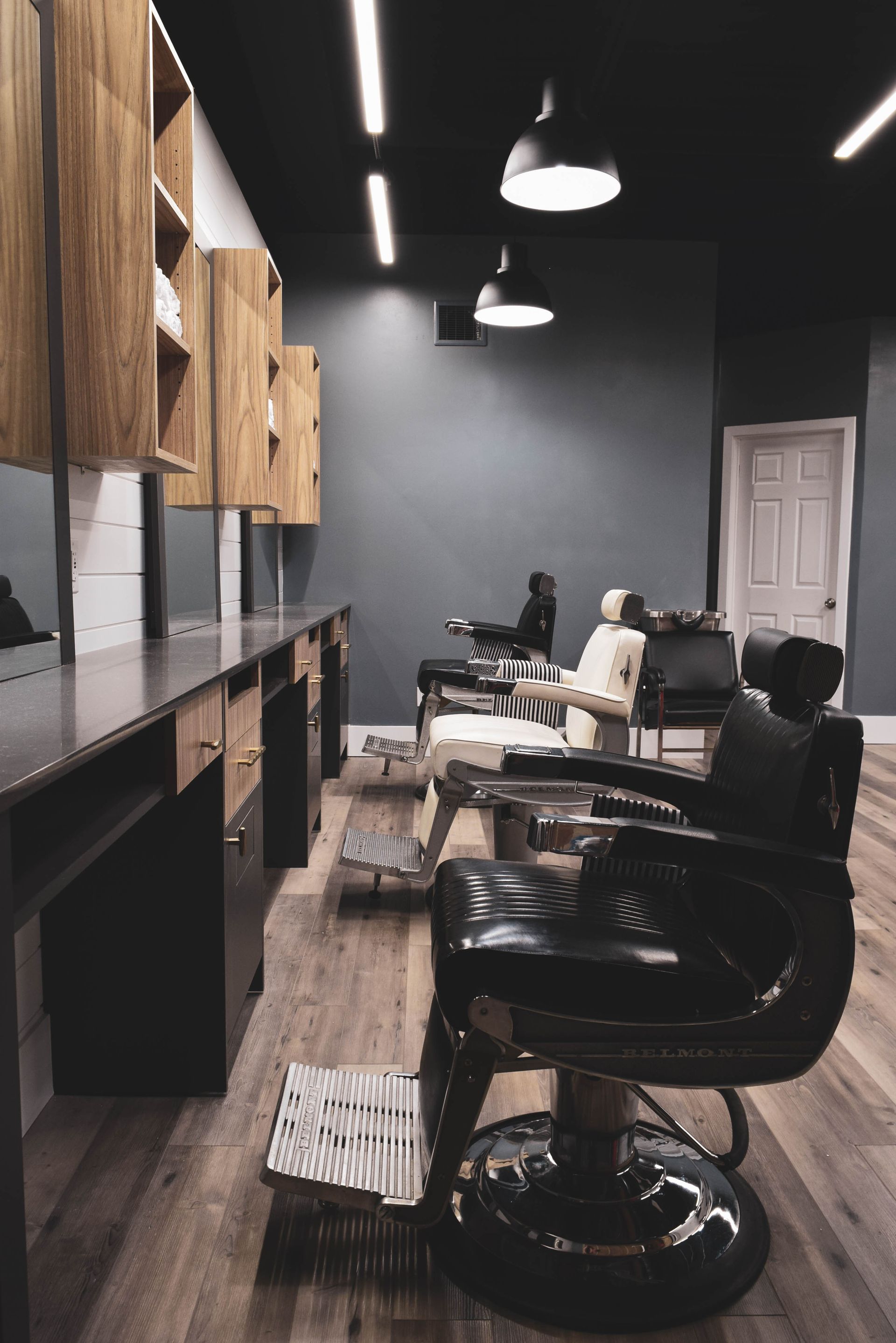 There is a barber chair in the middle of the room.