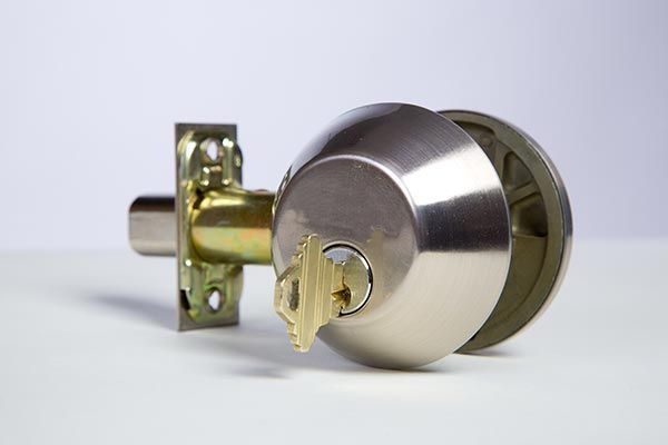 Deadbolt lock with key for home security installation by Columbia Lock and Safe in Columbia, MO - locksmith services available.