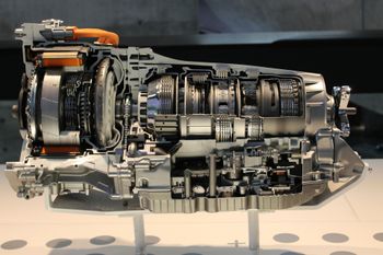 Cutaway of a hybrid car transmission and motor assembly on a display stand | Geiger’s Automotive & Diesel Repair