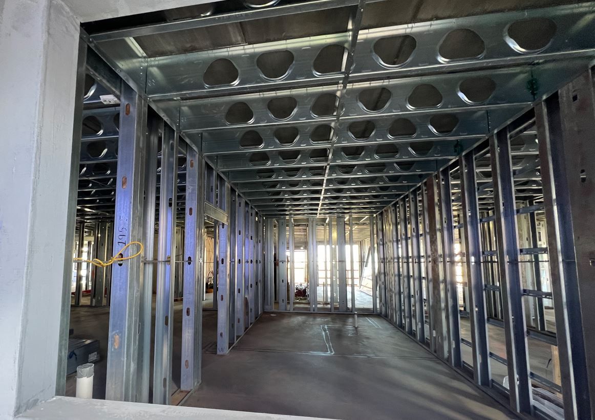 A building under construction with a lot of metal frames.