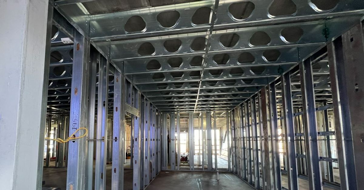 A building under construction with a lot of metal frames.