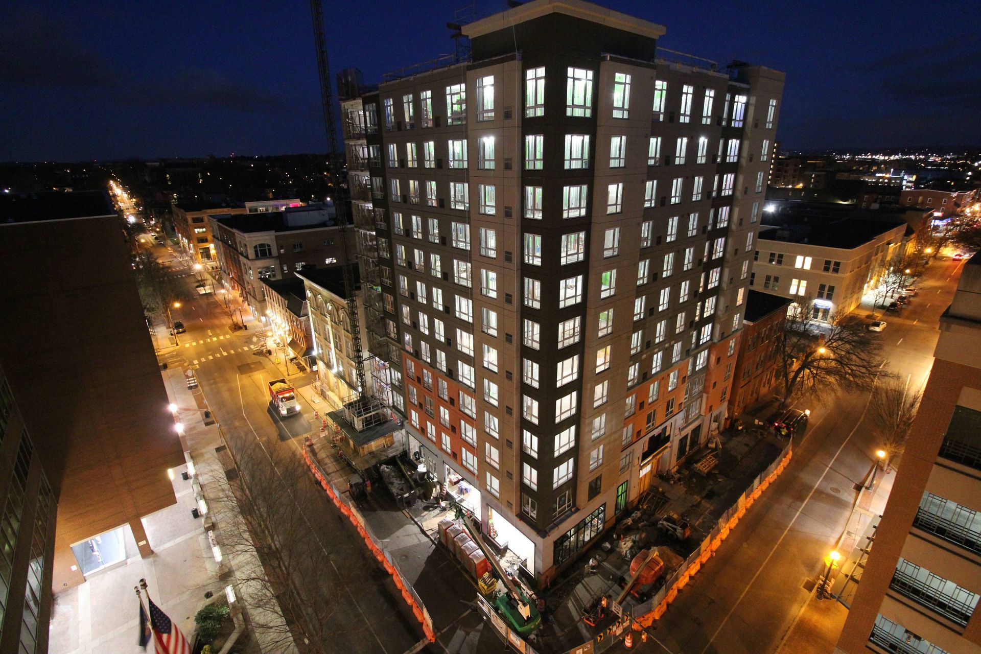 An aerial view of a large building lit up at night.