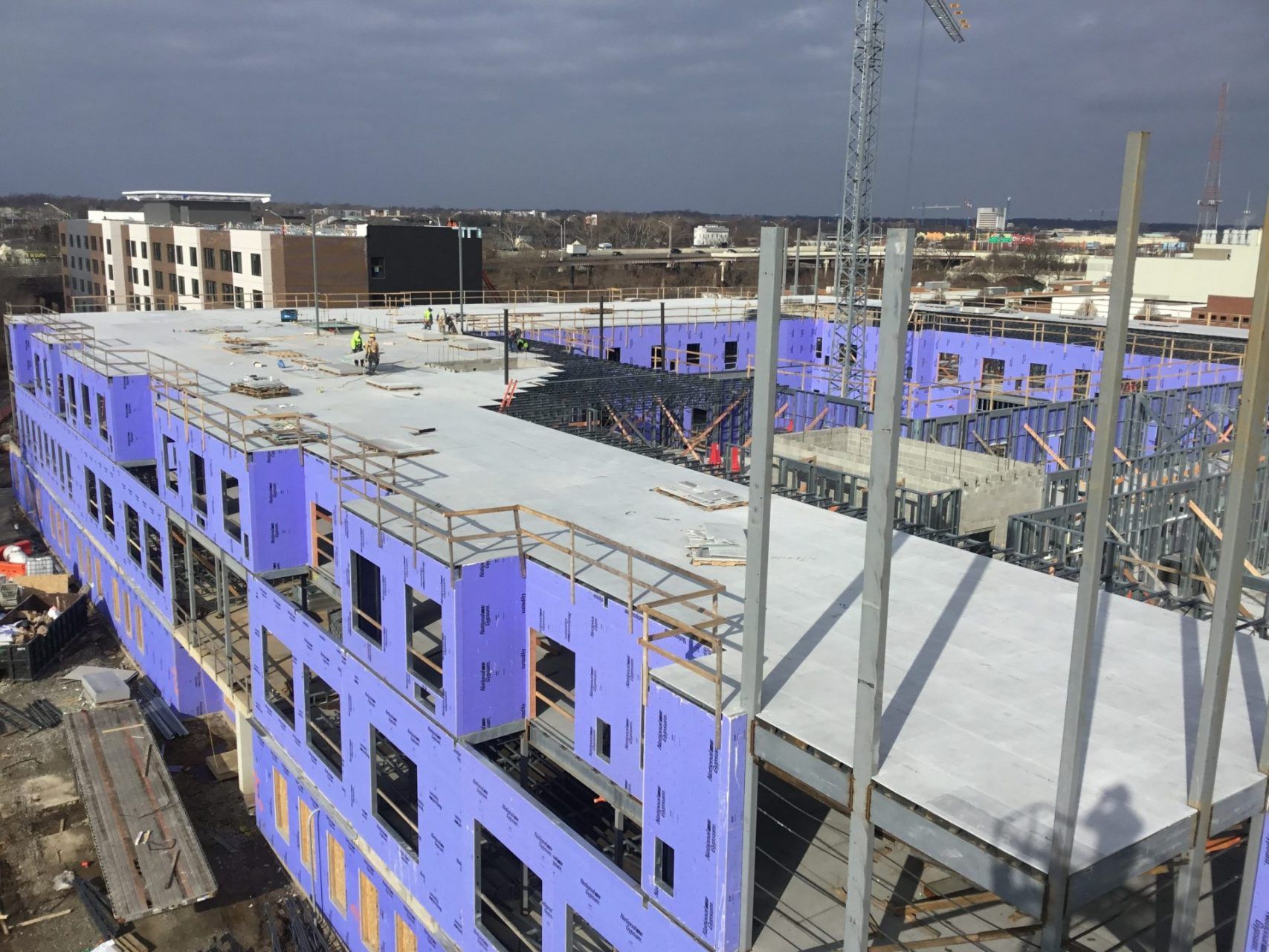 An aerial view of a large building under construction.