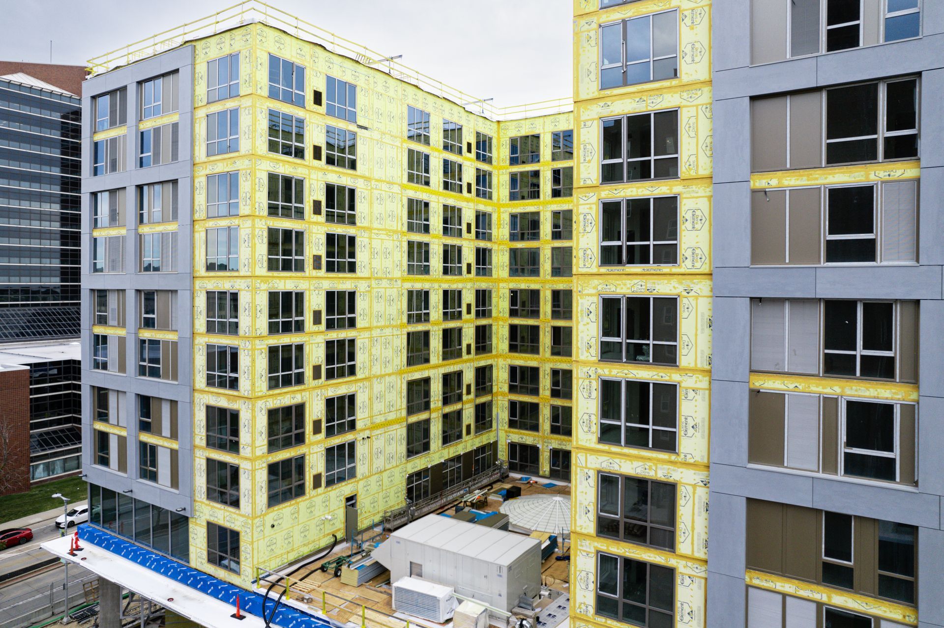 A large building with a lot of windows is being built.