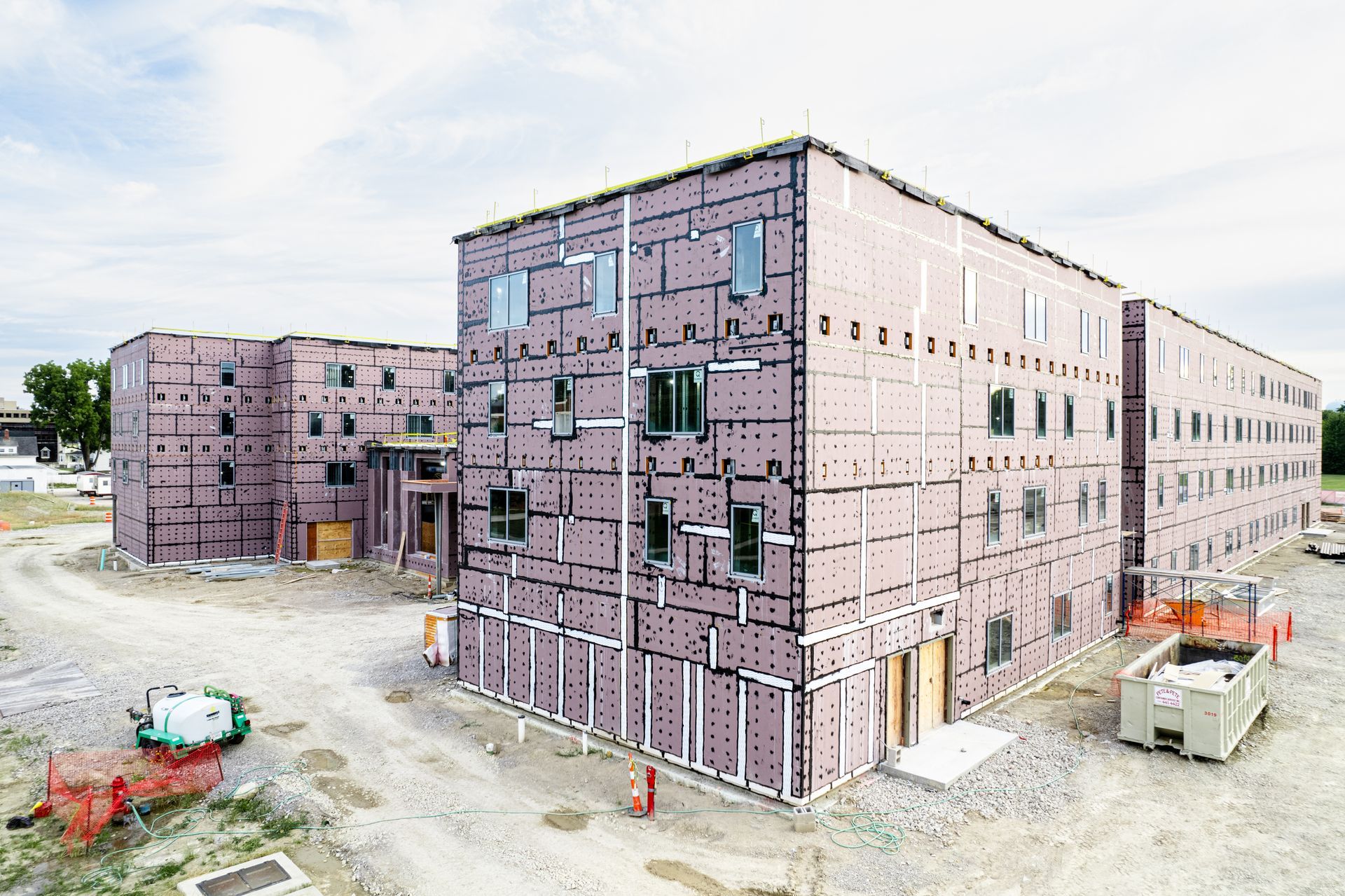 A large building with a lot of windows is being built.