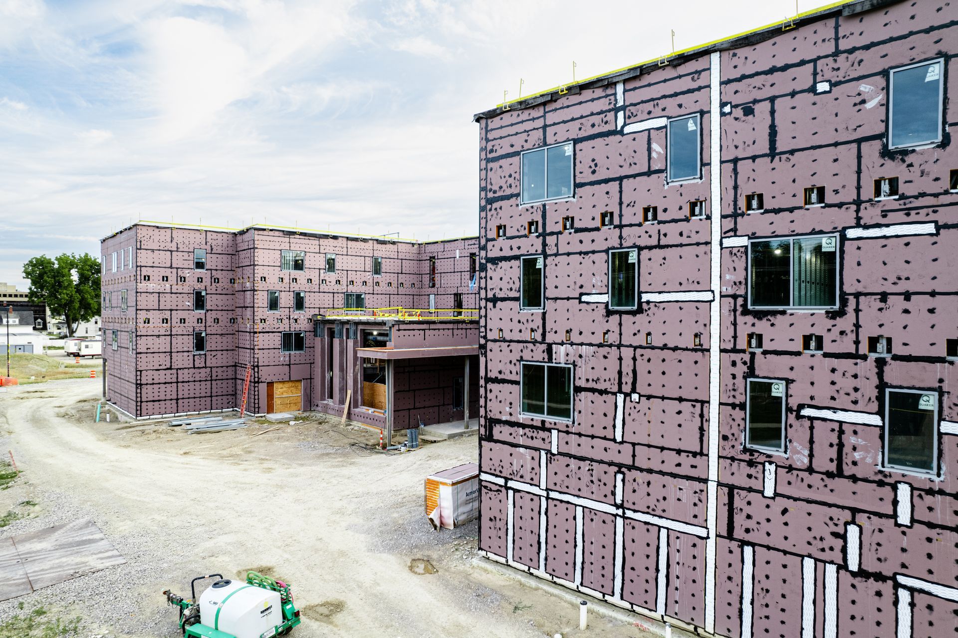 A large building with a lot of windows is being built.