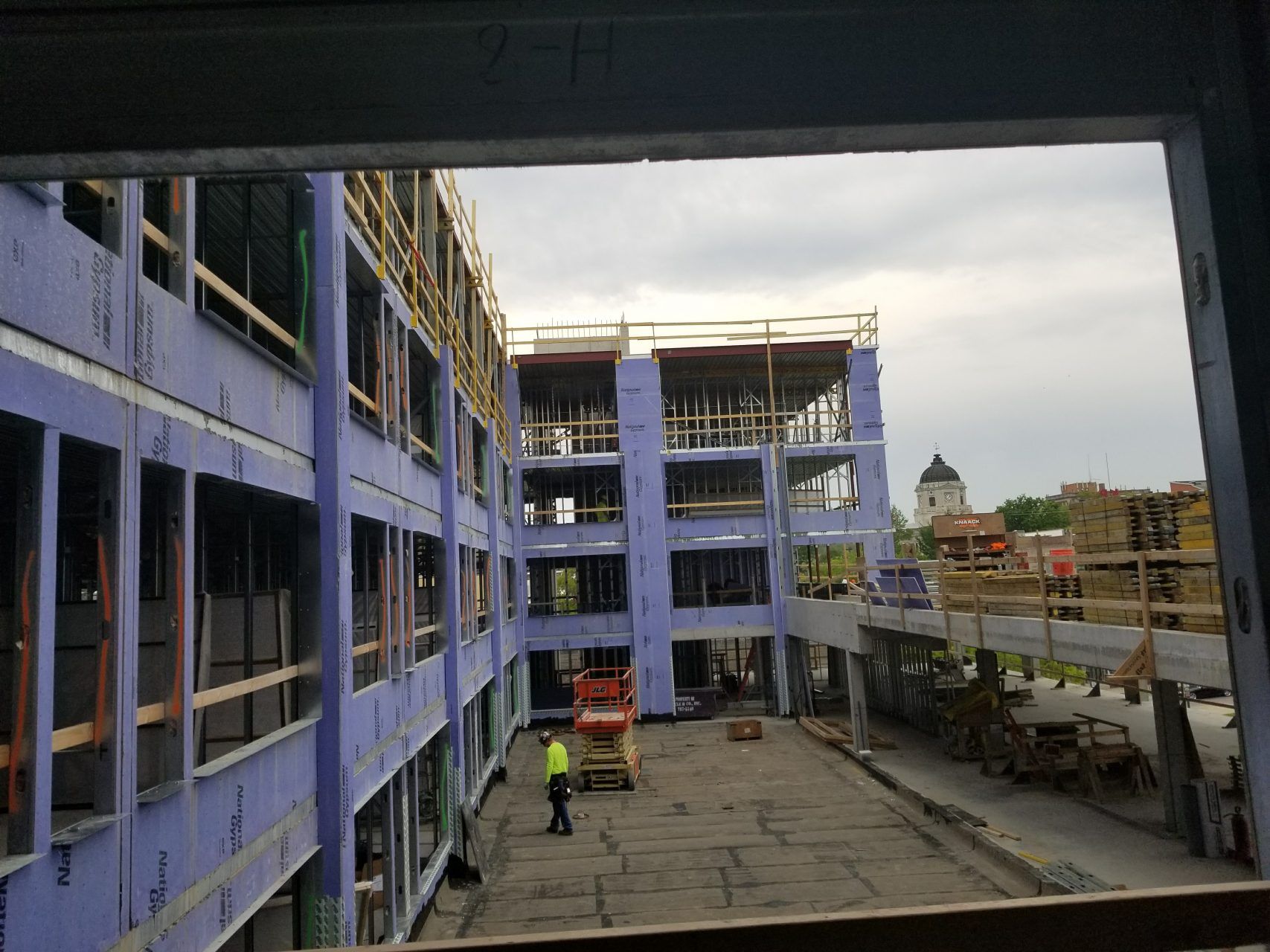 A large building under construction with a lot of windows.