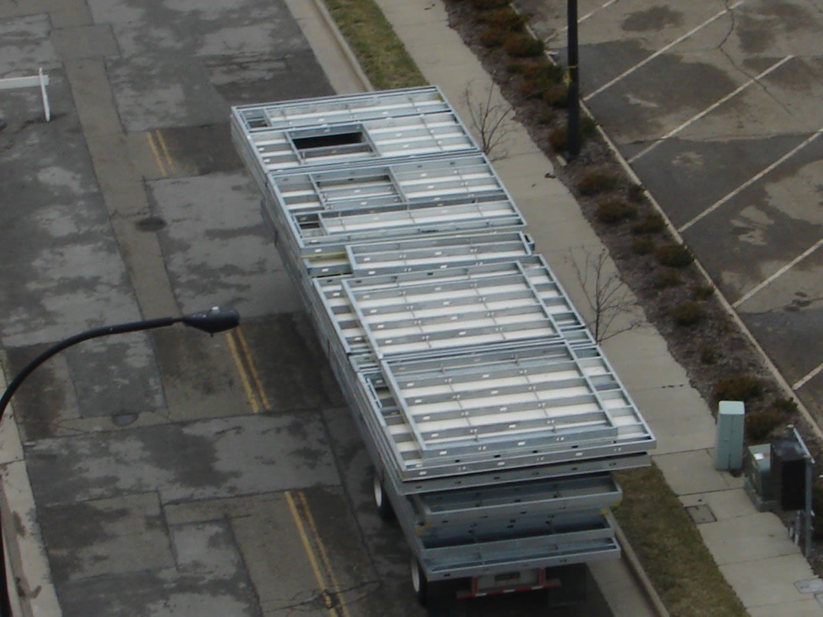 An aerial view of a truck parked on the side of the road.