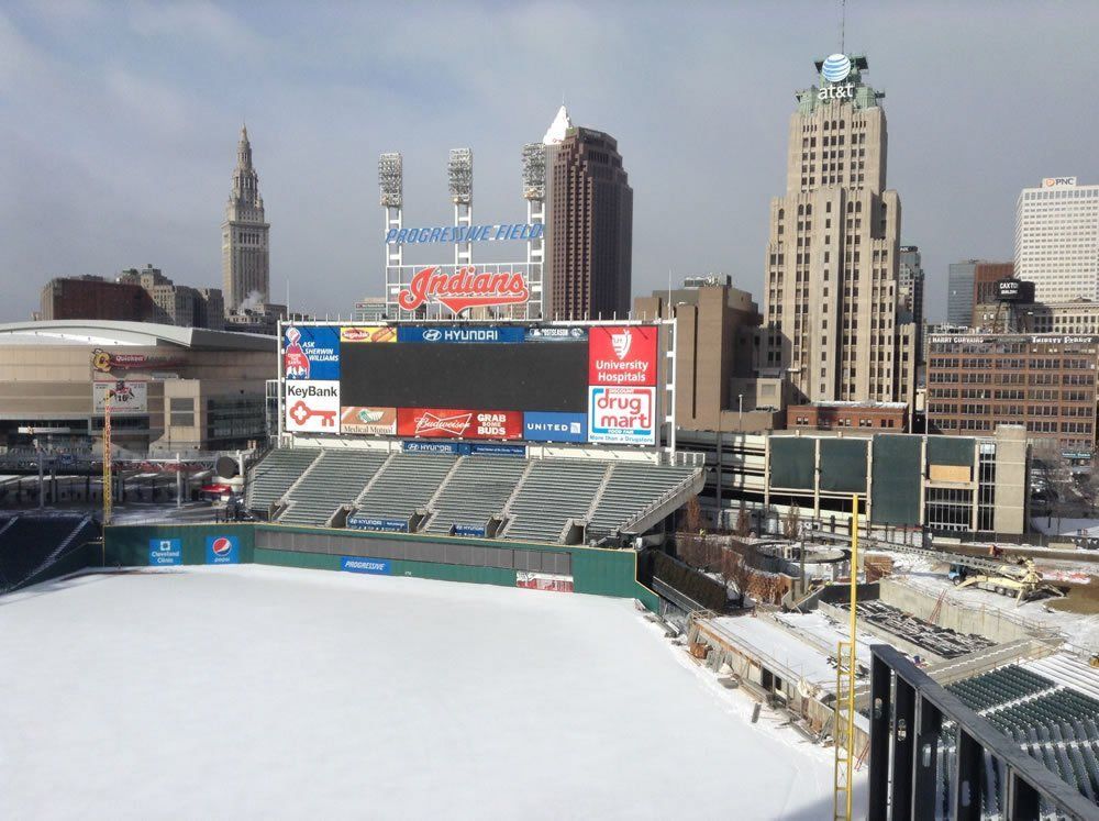The Cleveland Indians stadium with a scoreboard that says Milwaukee on it.